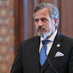 State Senator Robert Martwick stands in the Senate Chamber.