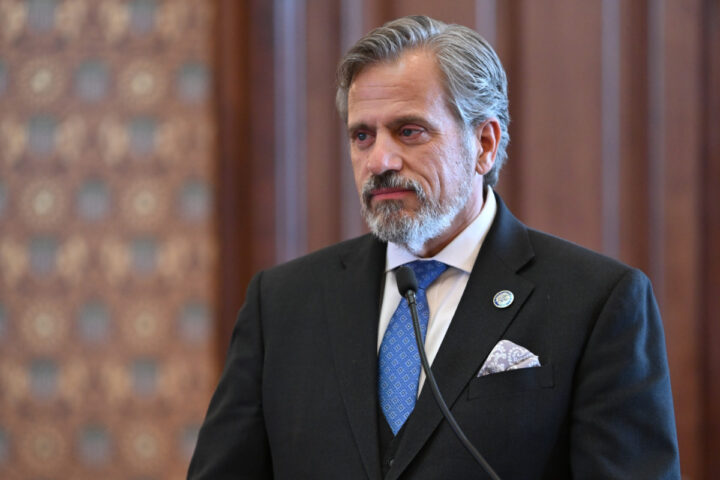 State Senator Robert Martwick stands in the Senate Chamber.